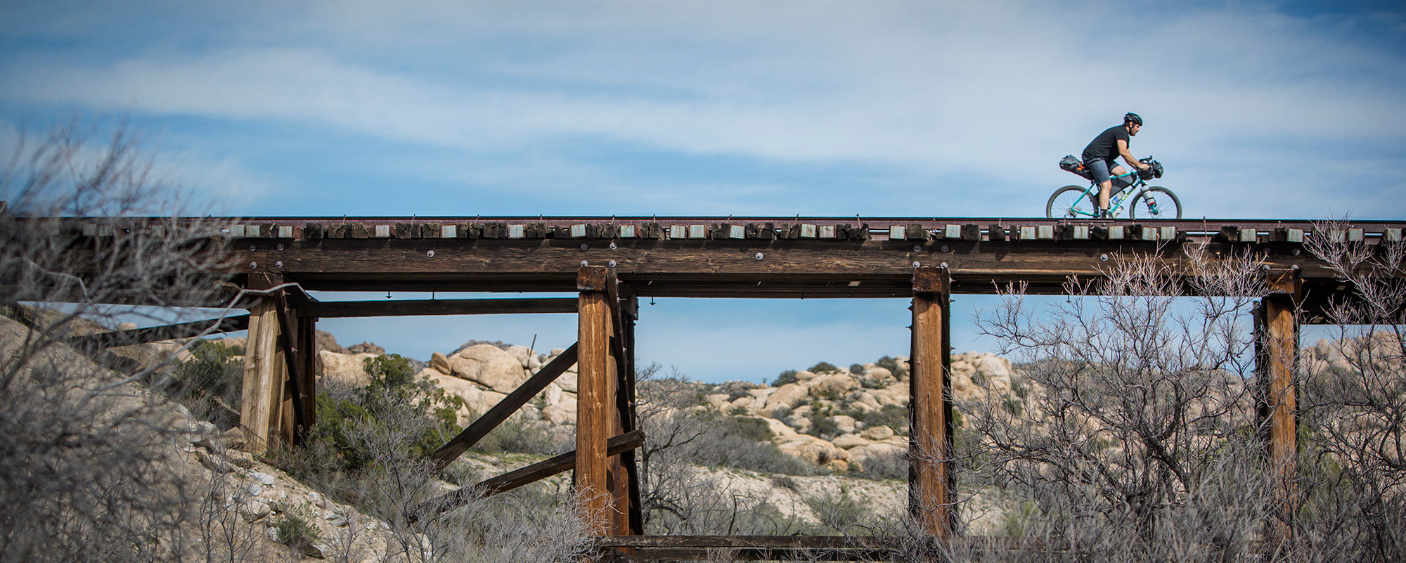 Bicycle rider on trestle